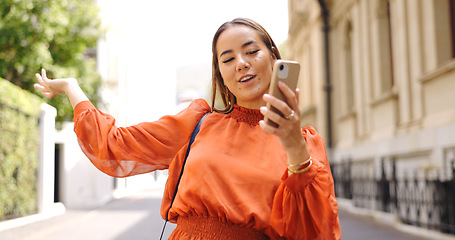 Image showing Asian woman, phone and talking on video call in city, live streaming or vlogging. Influencer, cellphone and person on virtual chat in urban street, speaking or discussion outdoor for content creation