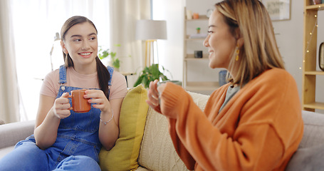 Image showing Relax, coffee and friends on a sofa talking, content and bonding on the weekend together. Tea, women and conversation on a couch, smile and chilling in a living room while enjoying comforting drink