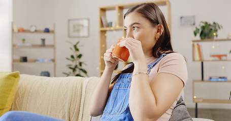 Image showing Relax, home and woman on couch, coffee and break for resting, thinking and daydreaming in living room. Female, latte and person with tea, natural aroma and gratitude with happiness, weekend and calm