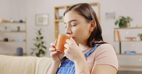 Image showing drinking coffee on the sofa for happiness, peace and morning break. Female, latte and person with tea, natural aroma and gratitude with happiness, weekend and calm