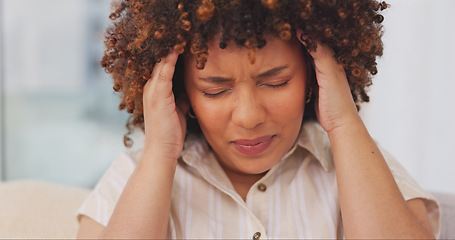 Image showing Laptop, headache and woman with pain on sofa in living room, feeling sick or tired. Mental health, anxiety and female remote worker with depression, burnout or stress, fatigue or migraine in home.