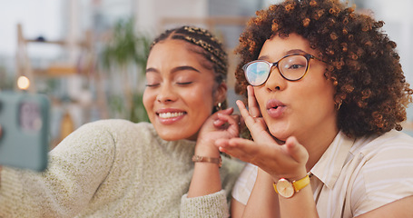 Image showing Happy women smiling for photo, memory or facial expression for social media post. Woman, friends and smile for selfie, vlog or profile picture together blowing kiss by living room table at home.