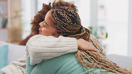 Image showing Friends, women hug and talking on sofa, bonding in home living room and communication. Girls, friendship love and smile of happy females hugging, embrace or cuddle, chatting, speaking or discussion.