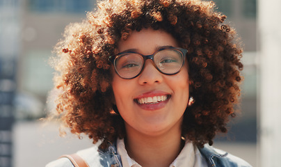 Image showing Business woman, happy and face of an employee walking in the city ready for work. Portrait, happiness and urban travel of a young person with a smile in the wind from success and walk in the sun