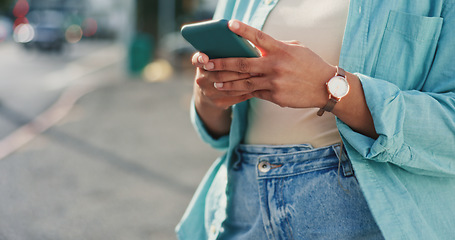 Image showing Woman, hands and phone typing in city for social media post, communication or texting in the outdoors. Hand of female chatting on mobile smartphone app for networking with 5G connection in urban town