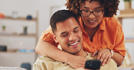 Image showing Love, social media and happy couple on sofa with phone, happiness and checking meme in apartment. Smile, man and woman on couch in living room, smartphone and quality time bonding together in home.