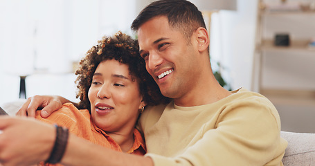 Image showing Video, love and entertainment with a couple watching tv on a sofa in the living room of their home together. Relax, film or television with a man and woman streaming series on a subscription service