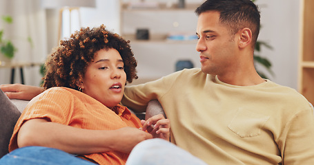 Image showing Trust, empathy and a couple talking on a sofa in the living room of their home together for understanding or support. Communication, love or conversation with a man and woman bonding through sympathy