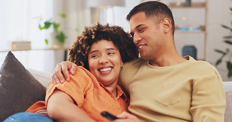 Image showing Film, love and entertainment with a couple watching tv on a sofa in the living room of their home together. Relax, video or television with a man and woman streaming series on a subscription service