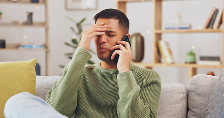 Image showing Angry, man and phone call communication in home with anger problem, stress and conflict on sofa lounge. Frustrated male person, smartphone and talking for mobile conversation, argument and complaint