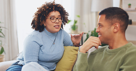 Image showing Love, talking and couple on a sofa, funny and conversation for relationship, loving and bonding. Partners, man and woman on couch, home and quality time for marriage, happiness and relax in lounge