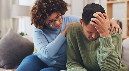 Image showing Couple, depression and woman comfort man with empathy, support and love while sitting in living room at home. Grief, loss with mental health and sad, stress and people in relationship in crisis