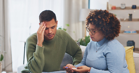 Image showing Pregnancy test, sad and couple hug in home with negative results on living room sofa. Depressed, infertility and man and woman embrace for support, comfort and care with fertility problem in house.