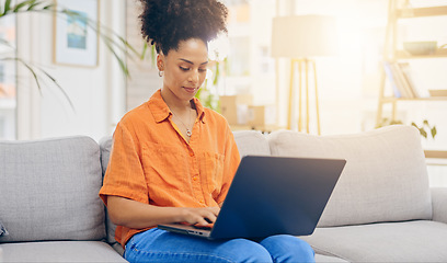 Image showing Laptop, thinking and woman typing on sofa in home living room, working or social media. Computer, remote worker and happy mixed race person or freelancer writing email, research or online browsing.