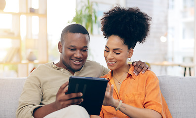 Image showing Tablet, couple and smile on sofa in home living room, bonding and online shopping. Interracial, technology and happy black man and woman in love on social media, internet browsing or web scrolling.