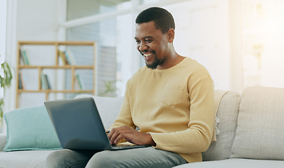 Image showing Typing, laptop keyboard and black man on sofa working on online report, research and internet blogging. Communication, remote work and happy male type on computer for website, writing email and busy