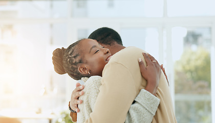 Image showing Black couple, dance together and hug in home with conversation, care and love with bonding. Man, woman and dancing with support, talking and romance with solidarity in house with trust in partnership