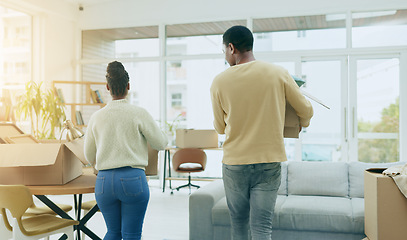 Image showing Black couple, hug and smile together in new home with conversation, care and love with bonding. Man, woman and celebration with support, pride or romance with solidarity in house for partnership goal