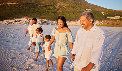 Image showing Big family, holding hands or happy kids at sea walking with grandparents on holiday vacation together. Dad, mom or children siblings bonding or smiling with grandmother or grandfather on beach sand