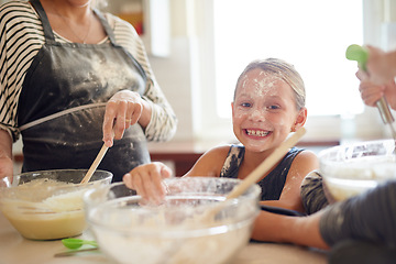 Image showing Portrait, playing or messy girl baking in kitchen with a young kid smiling with flour on a dirty face at home. Smile, happy or parent cooking or teaching a fun daughter to bake for child development