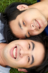 Image showing Love, lgbt and relax with portrait of gay couple in grass from top view for freedom, bonding and happiness. Smile, relationship and happy with face of asian men in park for romance, nature and care