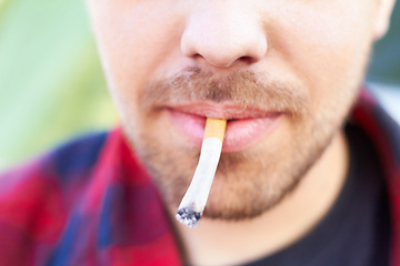 Image showing Cigarette, smoke and man with a tobacco habit and addiction due to unhealthy or bad lifestyle outdoor. Mouth, cancer and lips of young person or male smoker with substance or healthcare problem