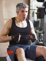 Image showing Breathing, exercise and mature man with a cable row machine, workout goals and wellness with health, power and strong. Male person, athlete and gym equipment for training, progress and challenge