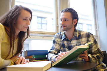 Image showing Education, man and woman studying with book in library, reading and learning together with research for project. University students, study group and people learn with textbook, knowledge and exam