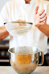 Image showing Baker hands, sifting flour and baking skill, cake or pastry with metal bowl closeup, dessert and person in bakery kitchen. Cooking, chef and catering industry tools and production with confectionery