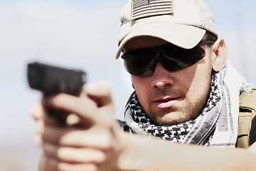 Image showing Violence, danger and a man shooting a gun with a target, military training and army service. Serious, risk and a fearless person or shooter with weapon for a violent crime or practice at shoot range