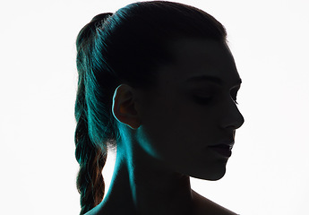 Image showing Woman face, beauty and silhouette with shadow in studio for creativity, dark art deco and white background. Girl, model and neon profile for creative fantasy, dream aesthetic and mystery by backdrop
