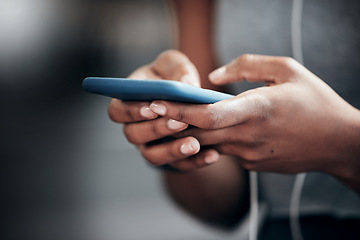 Image showing Phone, hands or person in gym on social media to relax on break in fitness training, exercise or workout. Chat closeup, texting or healthy sports athlete typing on mobile app for online blog content