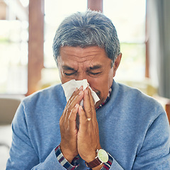 Image showing Senior man, sick and nose blowing in home from virus, allergy and illness with fever Tired, tissue and elderly male person in a house lounge with sneeze from covid and flu with hayfever allergies