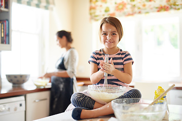 Image showing Portrait, flour or happy girl baking in kitchen with parent for bonding, child development or food preparation. Dirty, fun or young kid mixing pastry in bowl cooking playing for learning a recipe