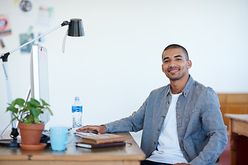 Image showing Professional man, portrait and smile at creative startup, confidence with pride in agency workplace. Confidence, success and career mindset, male person at desk with ambition at advertising firm