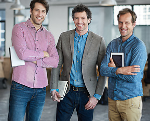 Image showing Team, portrait or happy business developers in meeting for brainstorming together in office with smile. Diversity, tablet or designers smiling with digital technology, notes or notebook in workplace