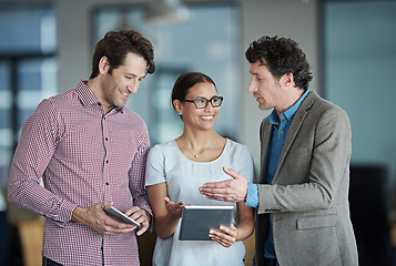 Image showing Teamwork, tablet or happy business people with research in meeting for brainstorming together in office. Diversity, collaboration or employees speaking of technology or digital network in workplace