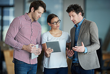 Image showing Team discussion, tablet or business people with research in group meeting for talking together in office. Diversity, collaboration or employees speaking of technology or digital network in workplace