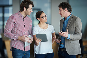 Image showing Team discussion, tablet or business people with ideas or research in group meeting talking together. Diversity, collaboration or employees speaking of technology data or digital network in office