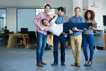 Image showing Funny, portrait or happy web designers in office with support, teamwork or playful joke together. Diversity, silly workplace humor or playful developers carrying woman or lifting an employee on break