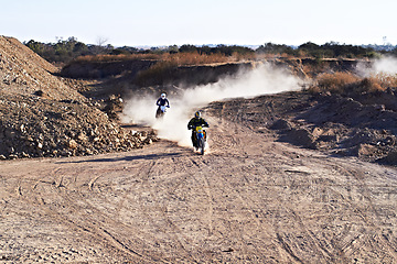 Image showing People in race, motorcycle and sport with speed, action and energy on off road track, transportation and outdoor. Competition, dirt bike and performance with fast biker, exercise and challenge