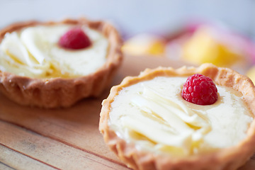 Image showing Cream tart closeup, dessert and bakery with cake and sweet treat on wooden table. Pastry, catering and hospitality industry with food, baked goods and custard confectionery, rich snack and fresh bake