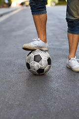 Image showing Ready, street and feet of a person for soccer, game and training for sports. City, sneakers and legs of a man with a football for sport, exercise and urban fitness in the road while playing a match