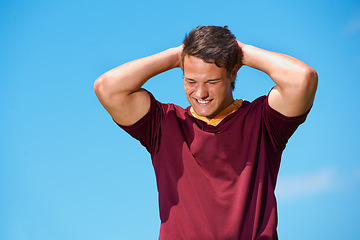 Image showing Face, rugby and happy athlete in training, exercise or workout in sport practice on blue sky background. Sports, man and player with hands on head, thinking or idea for fitness, game and performance