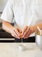 Image showing Baker, cracking egg and hands with breakfast in the kitchen for health, protein and nutrition. Bakery, morning and a chef or person with food in a container for a dinner diet or restaurant cooking