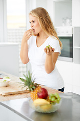 Image showing Fruits, eating grapes or woman thinking of a healthy morning meal, lunch meal or diet in kitchen at home. Breakfast, wonder or vegan girl enjoying fruit salad or food bowl to lose weight for wellness