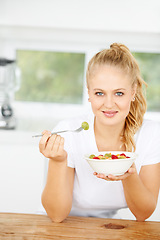 Image showing Fruit salad, eating or portrait of happy woman with a snack, morning breakfast or lunch diet in home kitchen. Face, gut health or girl with fruits, grapes or food bowl meal to lose weight or wellness
