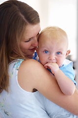 Image showing Woman hug baby, bonding and love with growth, development and early childhood, family and care. Young mother, newborn and parenting, happiness and childcare with motherhood, infant and cute kid