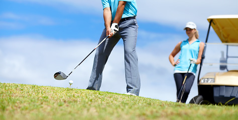 Image showing Low angle, man or golfer playing golf for fitness, workout or exercise to swing with driver on course. Ball, person golfing or hands of athlete training in sports game driving with a club stroke