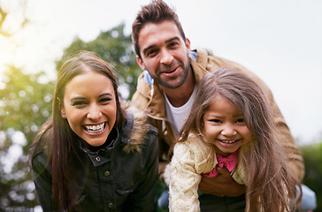 Image showing Family, laughing and park with face of parents, dad and girl together with mom and smile. Outdoor, portrait and vacation of a mother, father and kid with bonding, parent love and young child care